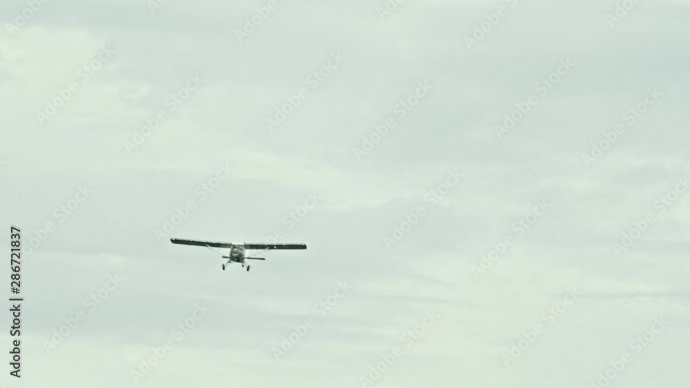 Army liaison aircraft flying in the sky Army liaison aircraft flying in the sky