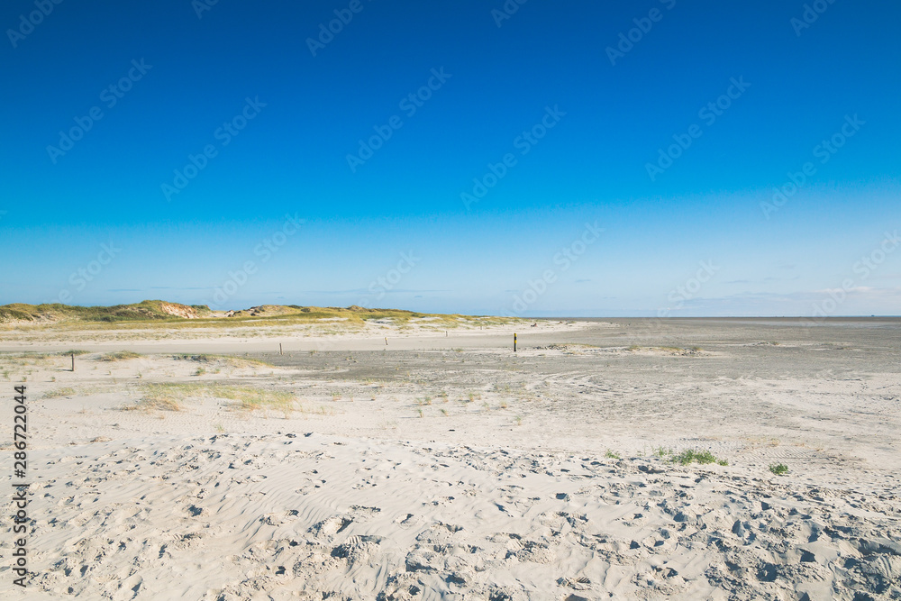 The Beach of Sankt Peter-Ording - Sand Dunes - Northern Germany - Schleswig-Holstein The Beach of Sankt Peter-Ording - Sand Dunes - Northern Germany - Schleswig-Holstein