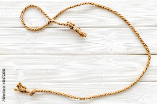 rope frame on white wooden background top view mock up