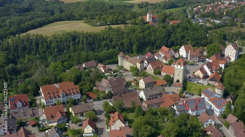 Aerial view of the village and castle Vellberg in Germany on a sunny day in spring. Round pan to the right above the village and the castle. photo