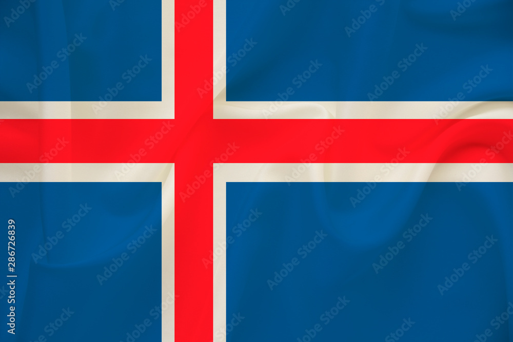 Fototapeta premium national flag of the country iceland on delicate silk with creases from the wind, concept of travel, immigration, politics, copy space, close-up