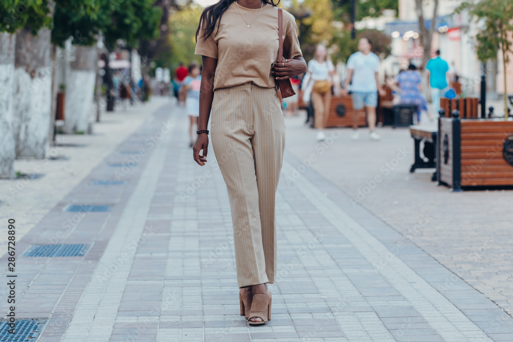 Outdoor full fashion portrait of fashionable black woman skin