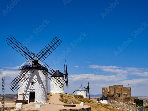 Old windmills and castle in the town of Consuegra, Spain