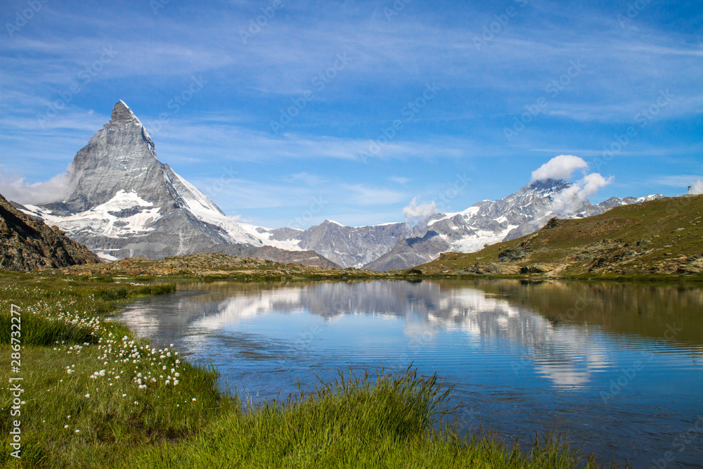 Matterhorn and Dente Blanche from Riffelsee mountain lake above Zermatt, Switzerland