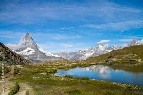 Matterhorn and Dente Blanche from Riffelsee mountain lake above Zermatt  Switzerland