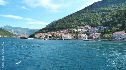 Slow Motion, Ferry boat sails from Kamenari to Lepetane in Bay of Kotor, Montenegro photo