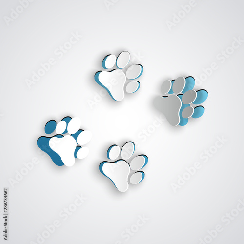 Paper cut Paw print icon isolated on grey background. Dog or cat paw print. Animal track. Paper art style. Vector Illustration