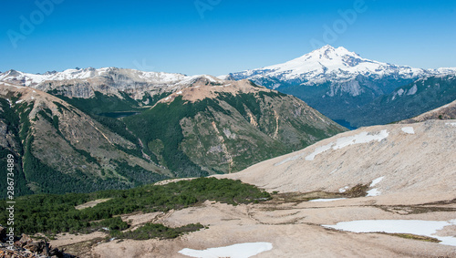 Hiking, camping and backpacking on iceberg and snow with the views of the Andes mountains and lake near Refugio Italia Manfredo Segré (Laguna Negra) in Patagonia, Argentina. Winter backpacking. Pampa  photo