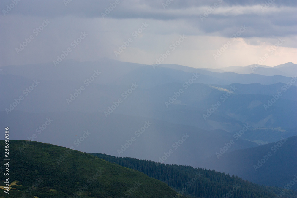 The majestic view of the beautiful mountains. Relaxing travel background. Tourist routes. Carpathians. Ukraine. Europe. The majestic view of the beautiful mountains. Relaxing travel background. Tourist routes. Carpathians. Ukraine. Europe.