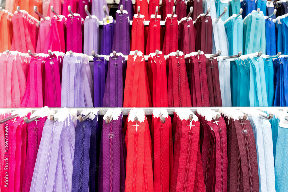 Φωτογραφία variety of zippers at market