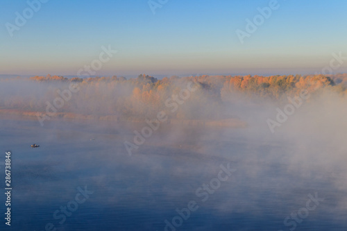 View on the Dnieper river in fog in the morning at autumn © olyasolodenko