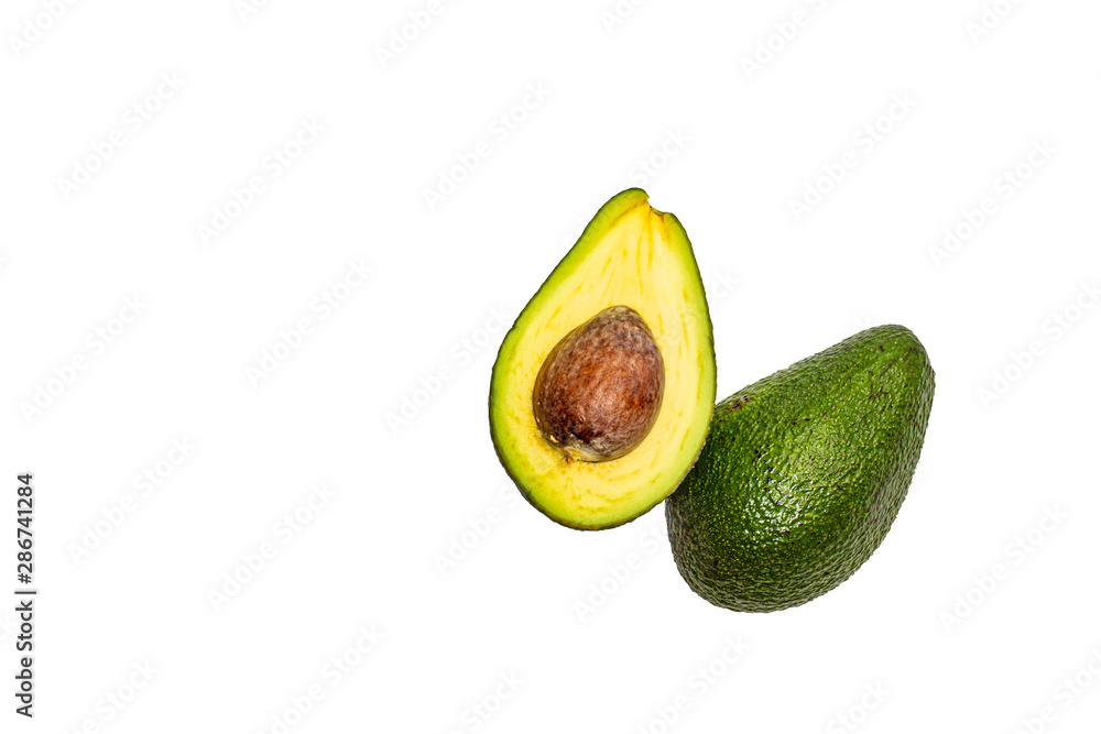 Two halves of avocado on an isolated background.