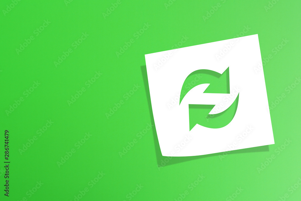 Note paper with recycle symbol on green background Note paper with recycle symbol on green background