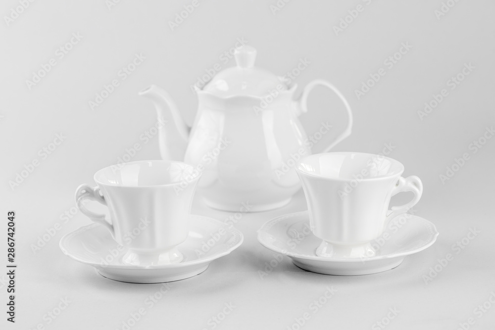 Cup of tea with teapot isolated on white background Cup of tea with teapot isolated on white background