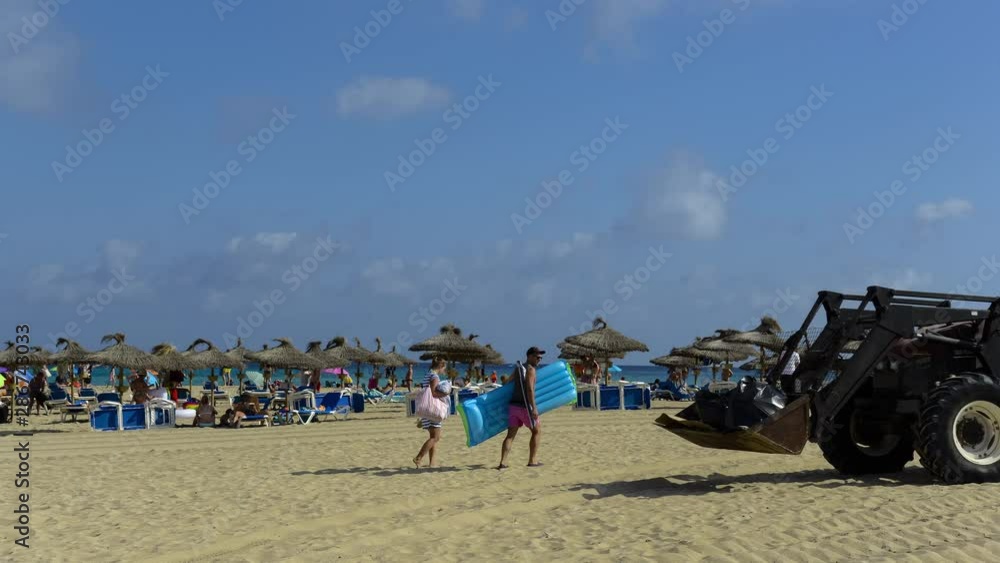 Maiorca Spain, some people go to straw umbrellas and deckchairs Maiorca Spain, some people go to straw umbrellas and deckchairs