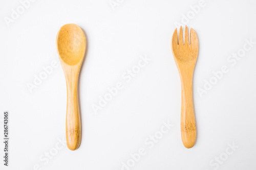 Wooden spoon and fork isolated on white