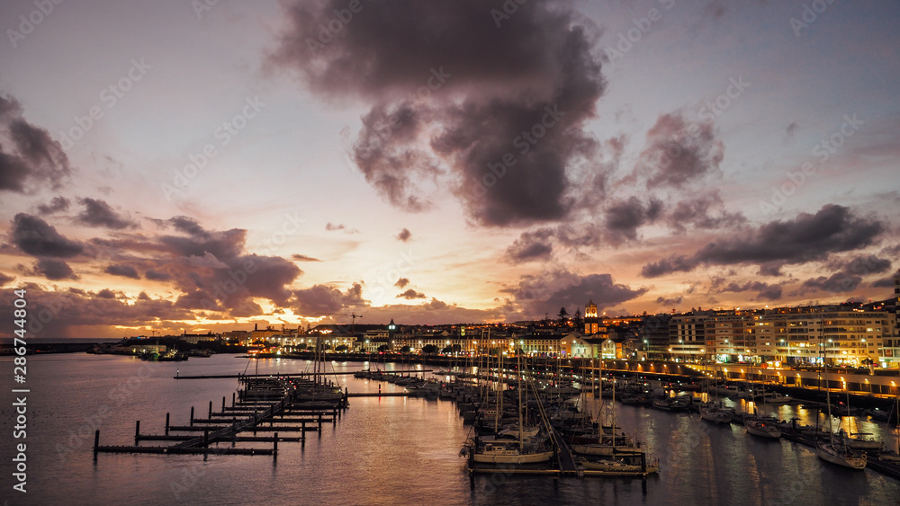 View of harbor at Ponta Delgada, Azores, Sao Miguel Island at sunset. Ocrober 10, 2018. Azores, Portugal.