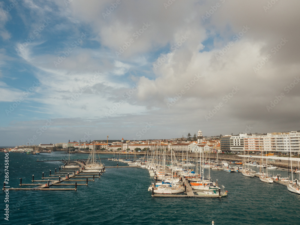 View of harbor at Ponta Delgada, capital city of the Azores at Sao Miguel Island at day time. Ocrober 10, 2018. Azores, Portugal.