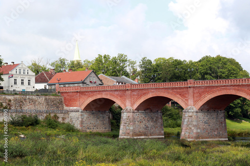 Large red brick bridge and old city