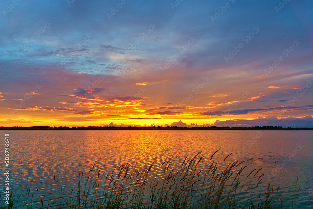 Summer sunset on Sorozhye Lake. Kostroma region, Russia.