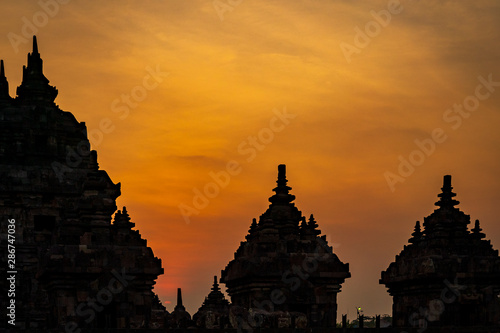 Beautiful Silhoette of Plaosan Buddhist Temple in golden hours sunset sky background, Java Island, Indonesia