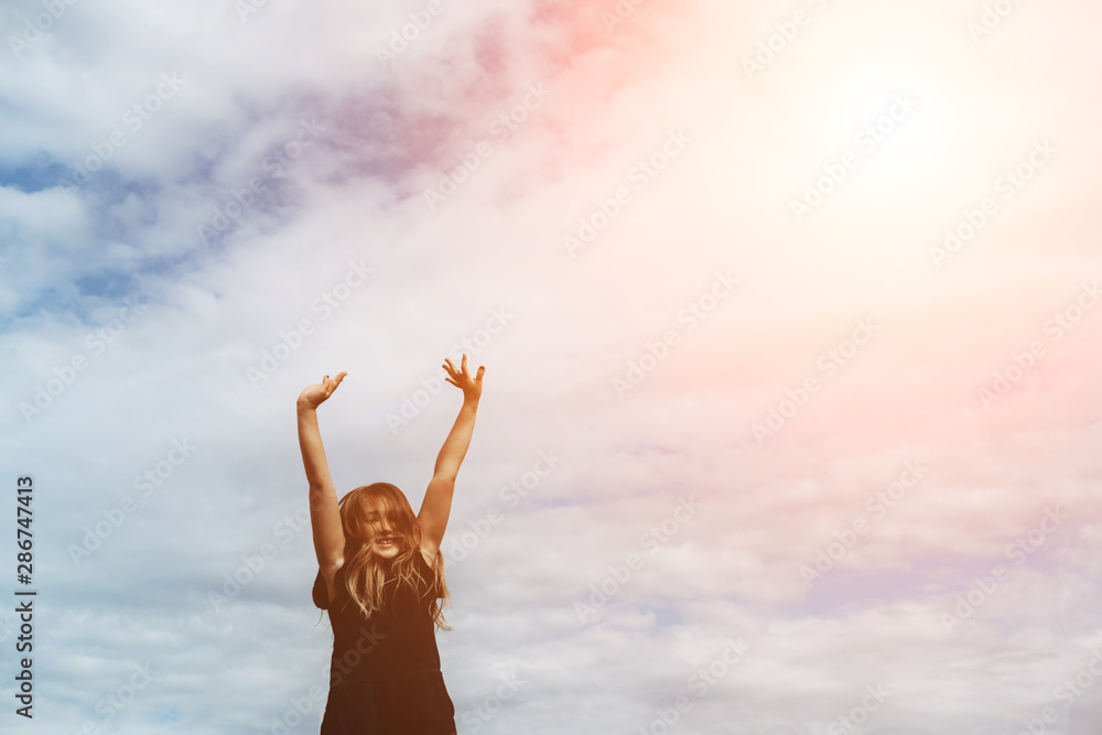 Happy girl rejoices summer. Young child playing outside. Summertime day activity. Happy, joyful kid outdoors. Having fun alone. Beautiful, scenic forest landscape. Picturesque scenery Happy girl rejoices summer. Young child playing outside. Summertime day activity. Happy, joyful kid outdoors. Having fun alone. Beautiful, scenic forest landscape. Picturesque scenery