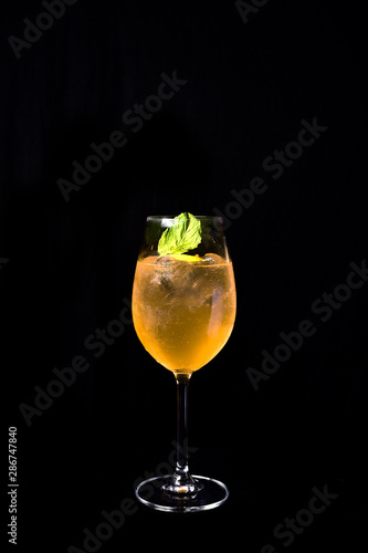 exotic and alcoholic drink with fruits on black background