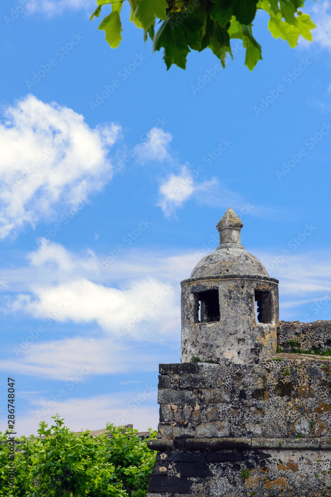 Old portuguese fort of Saint Blasia (Forte de Sant Bras) and the square of the city of Ponta Delgada. The gun at the entrance to the fortress. Island of San Miguel. Ponta Delgada, Azores, Portugal.
