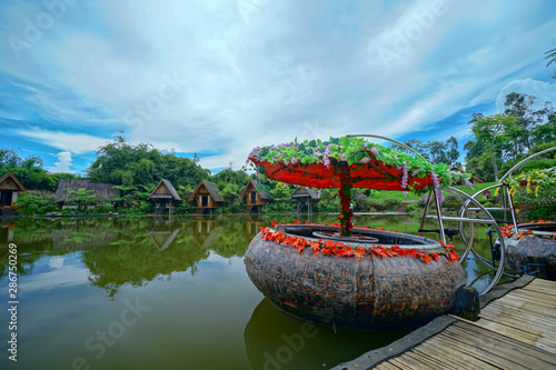 Fototapeta Naklejka Na Ścianę i Meble -  Small houses with terrace by the lake in Lembang, Indonesia