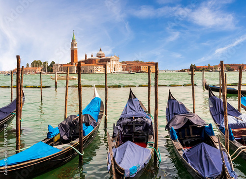 picturesque view at a Venice chanel vith gondolas and nice old builginds on the other side , Venice © Yaroslav