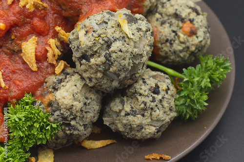 Meatballs with mushrooms and tomato sauce. photo