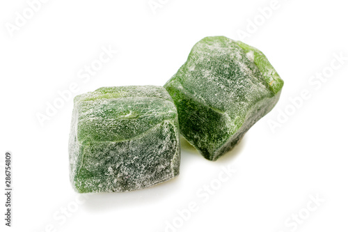 Turkish delight. Mint rahat locum, two pieces of sweet oriental delights in powered sugar. Close-up view.
