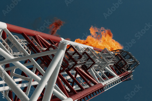 Flare boom nozzle and fire on offshore oil rig photo