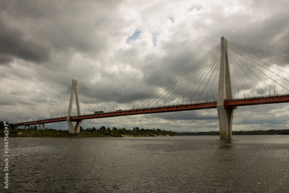 Cable-stayed bridge in Murom Russia across the Oka river on a summer cloudy day Cable-stayed bridge in Murom Russia across the Oka river on a summer cloudy day