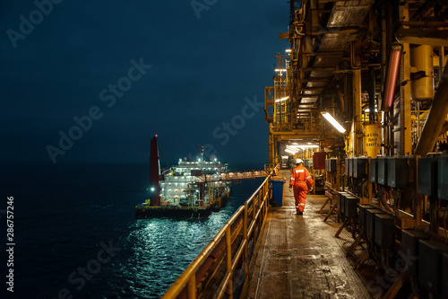 Man walking on offshore vessel photo