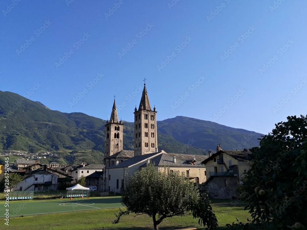 Santa Maria Assunta Cathedral - bell towers in medieval city of Aosta, Italy Santa Maria Assunta Cathedral - bell towers in medieval city of Aosta, Italy