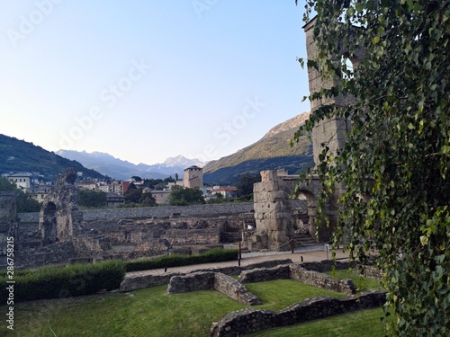 Fototapeta Naklejka Na Ścianę i Meble -   Roman ruins in Aosta, Italy. Ancient theater. Teatro Romano
