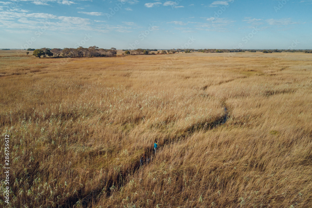 Top angle view of Cuando river flood plains and small forested islands Top angle view of Cuando river flood plains and small forested islands
