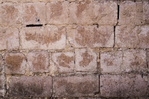 Old white brick. Brickwork. Old brickwork. The wall is built of white brick. Architectural texture. Silicate brick. Dirt on the wall.