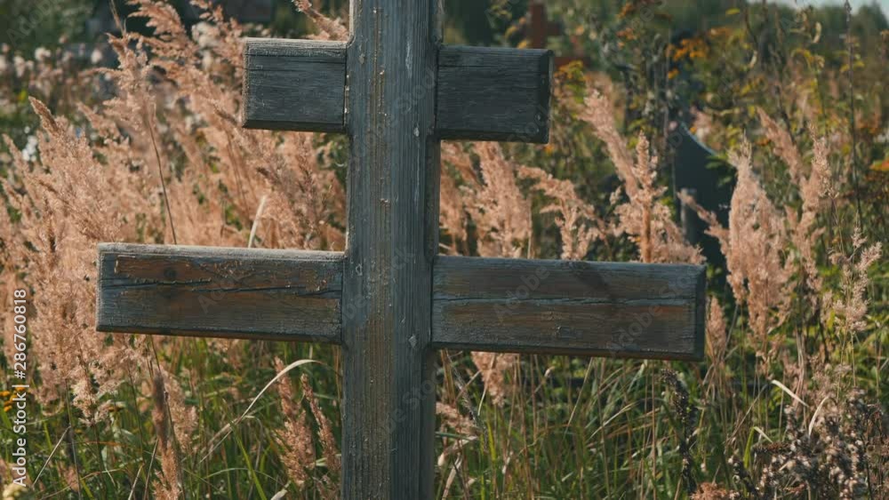 Wooden Cross In Cemetery In Sunny Summer Day Gimbal Shot Ronin. Wooden Cross In Cemetery In Sunny Summer Day Gimbal Shot Ronin.