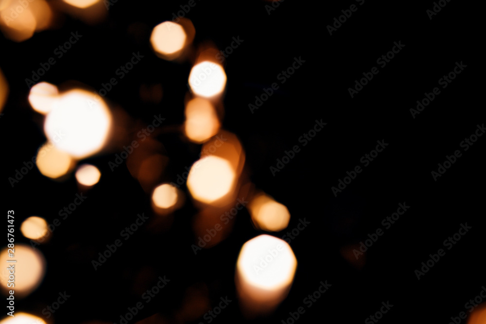 Golden abstract bokeh sparkle on black isolated background. Holiday concept. Place for design. Festive concept. Golden abstract bokeh sparkle on black isolated background. Holiday concept. Place for design. Festive concept.