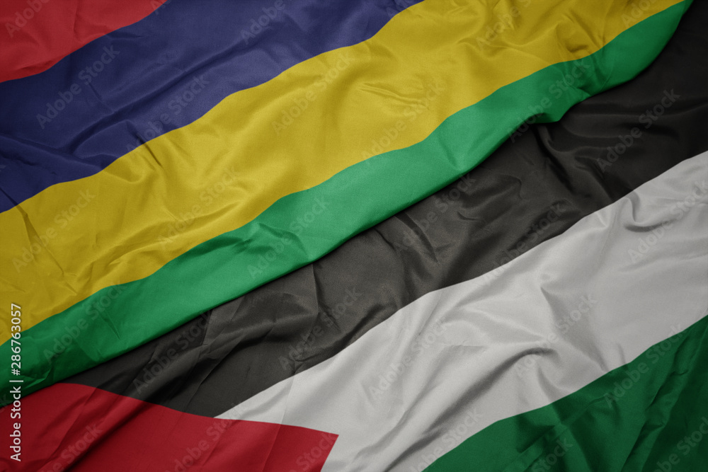 waving colorful flag of palestine and national flag of mauritius. waving colorful flag of palestine and national flag of mauritius.