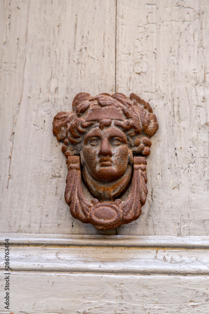Close up shot of ancient metallic door knocker