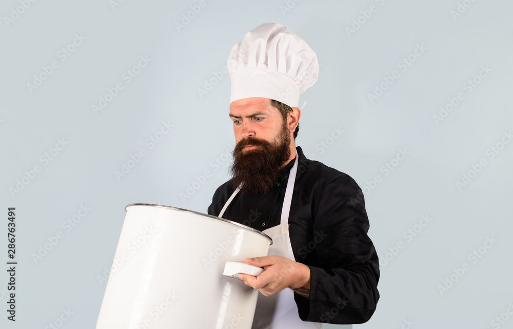 Cooking pot. Male chef cook holds big pot. Cooking, culinary. Food, profession and people concept. Saucepan, casserole. Cook man in apron holds saucepan in kitchen. Cookware, dinnerware, kitchenware. Cooking pot. Male chef cook holds big pot. Cooking, culinary. Food, profession and people concept. Saucepan, casserole. Cook man in apron holds saucepan in kitchen. Cookware, dinnerware, kitchenware.