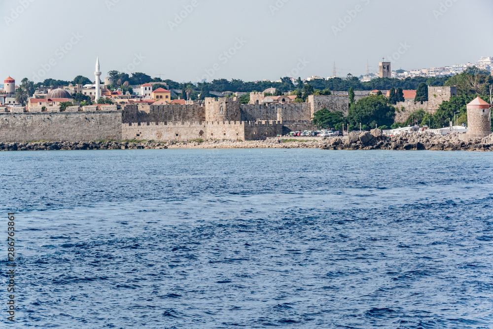 Views of the island of Rhodes while walking on a ship on the Aegean Sea.