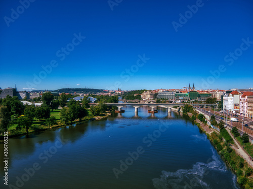 aerial flight over vltava river next to bridges sunny day of summer in Prague © Fabiano