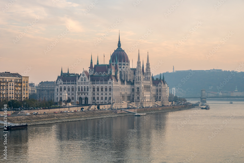 Aerial view of Budapest parliament and the Danube river at sunset, Hungary.