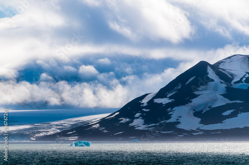 Icebergs floating in a fjord in the Arctic Ocean, Hornsund, Norway photo