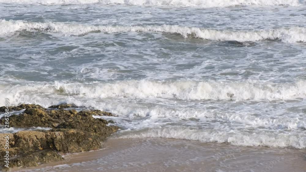 Fast motion waves and foam on the sea, amazing nature beach background. Royalty high-quality stock video footage 4k ocean water, sea sand. Big waves, clear water surface background for tex and design Fast motion waves and foam on the sea, amazing nature beach background. Royalty high-quality stock video footage 4k ocean water, sea sand. Big waves, clear water surface background for tex and design