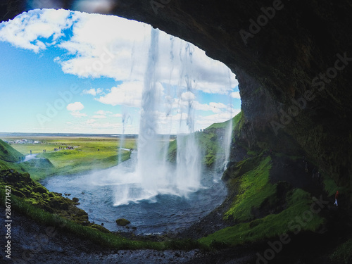 View of Seljalandsfoss Waterfall, tourist popular natural attraction in Iceland